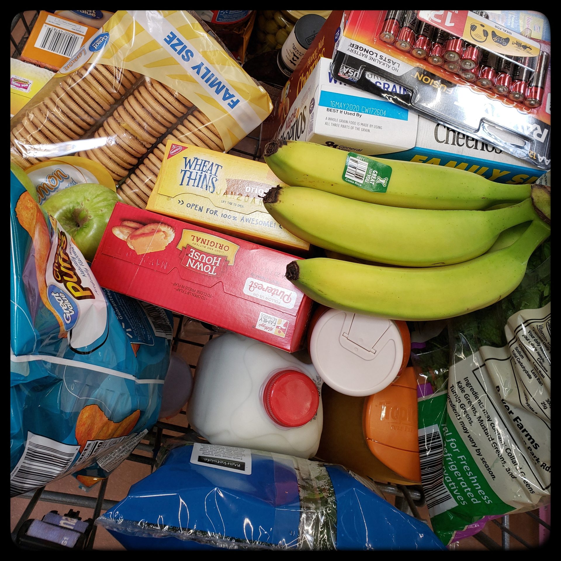 groceries piled in a cart
